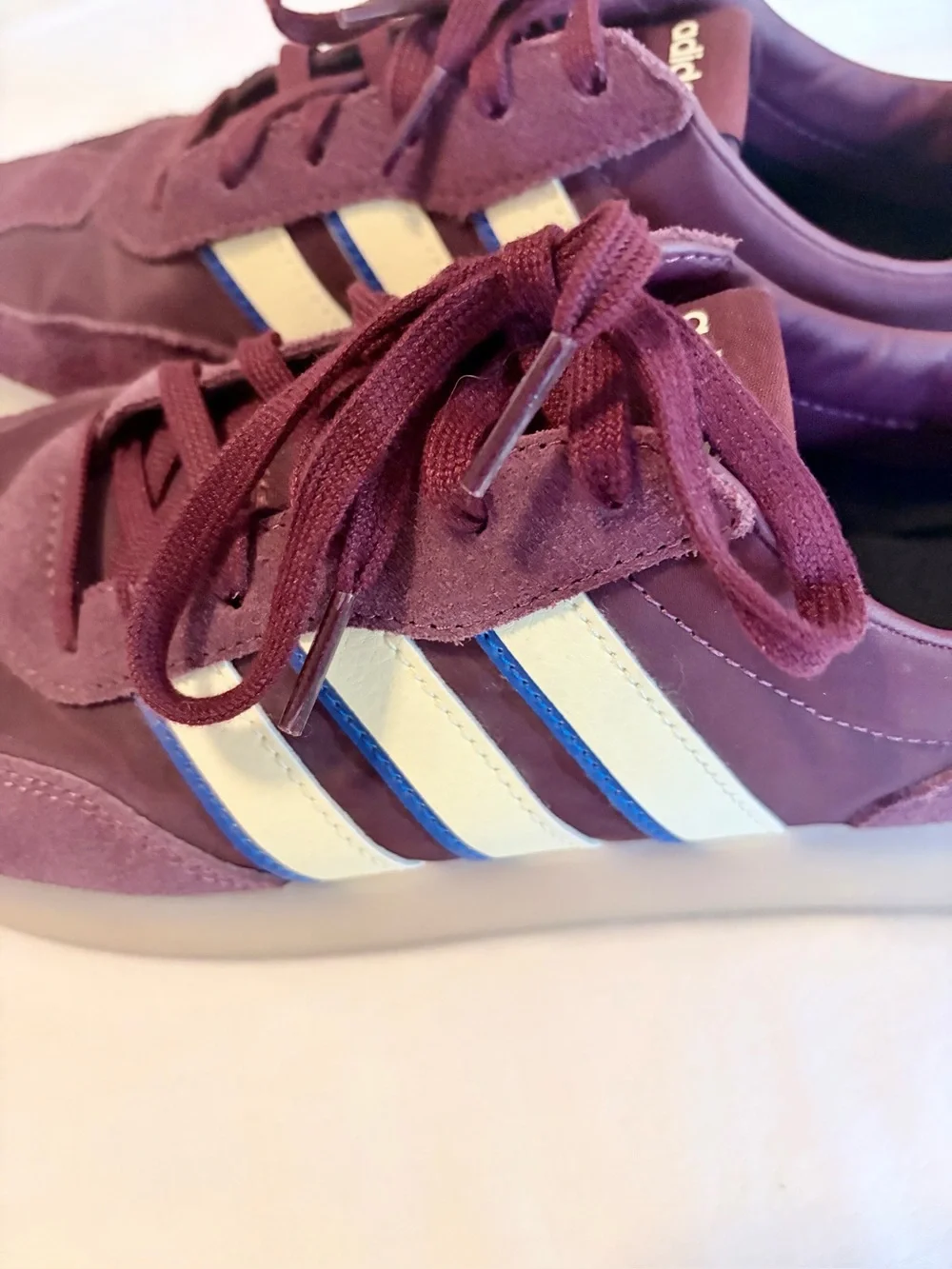 adidas burgundy and white suede sneakers with blue stripe accents